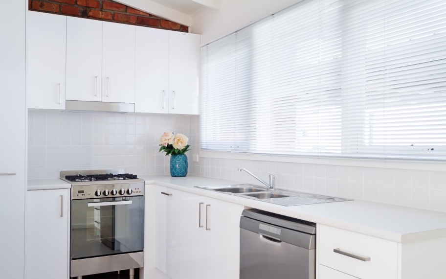 Polywood blinds in a kitchen with flowers